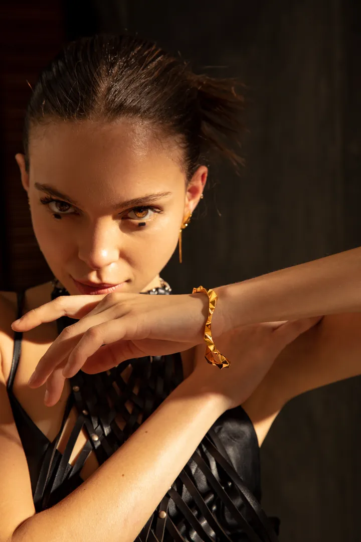 Gold cuff in shadow. Beauty & jewellery image, retouching by Mohammed Yasin.